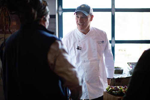 Chef Jeff Ault speaking with a guest at the 2019 Root to Table Culinary Series Kickoff