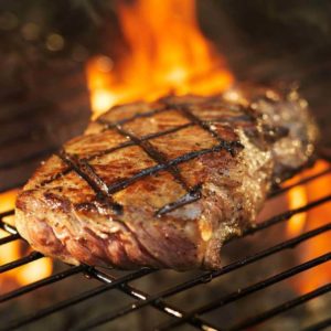 Steak on a grill at Audley Farm