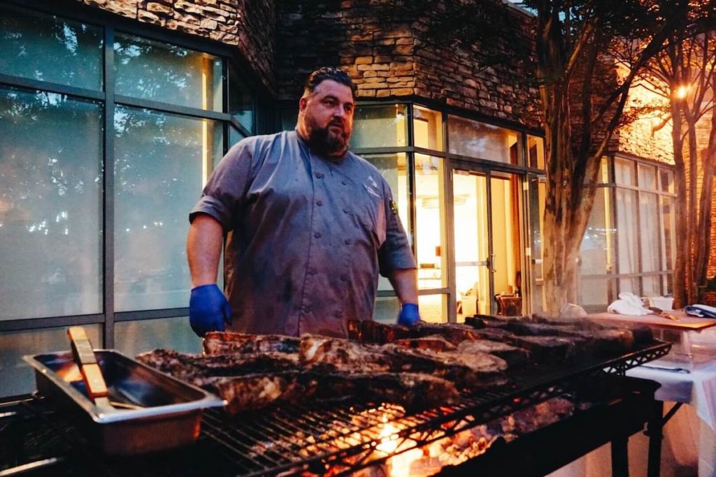 Chef Erik Foxx-Nettnin grilling steaks at Lansdowne Resort and Spa