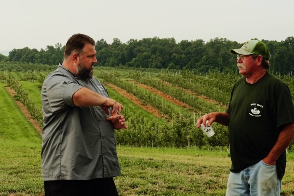 Chef Erik and Farmer David talking at West Oaks Farm