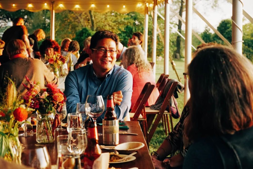 Guests having a conversation at Hillbrook Inn's 2019 Root to Table Dinner