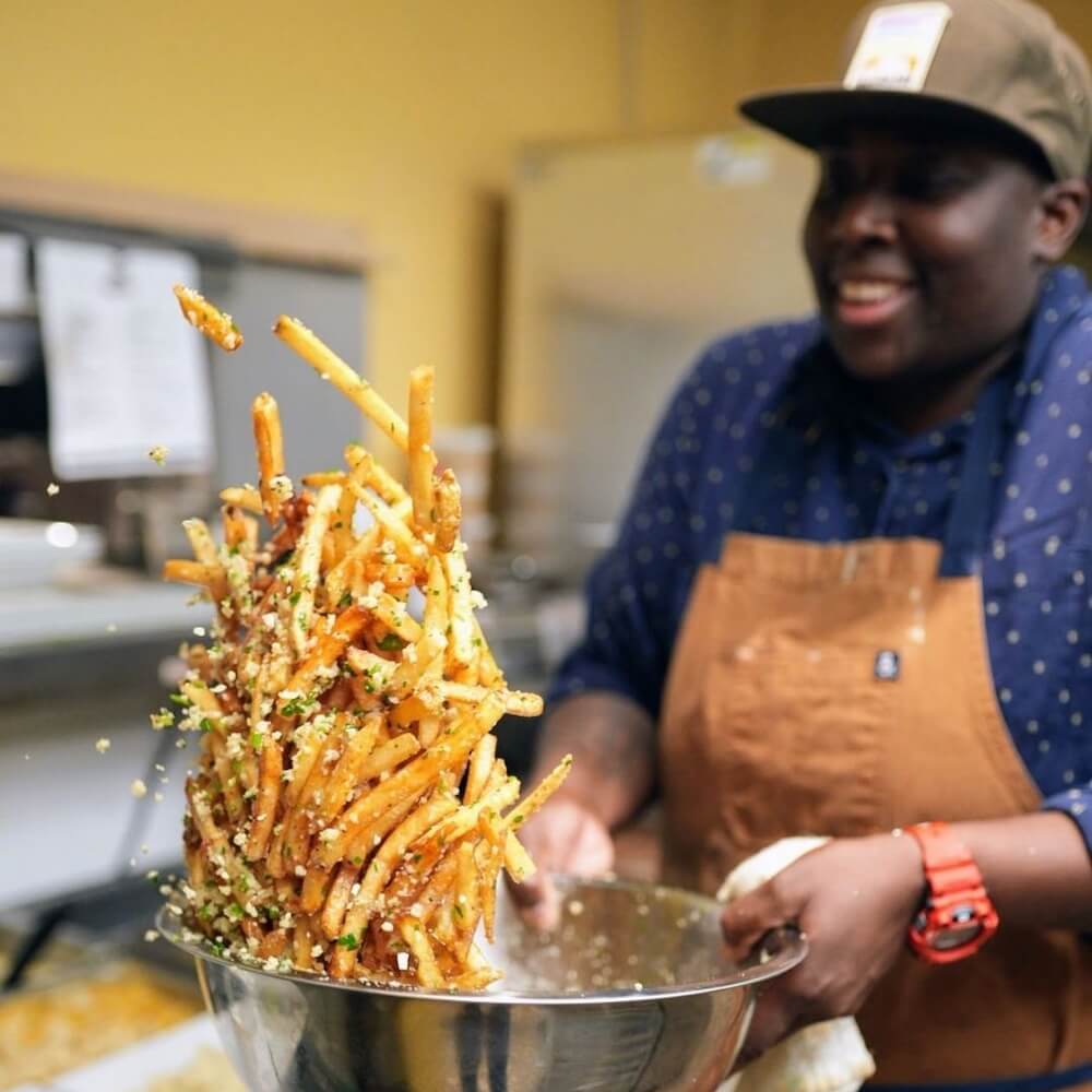Chef T tossing fries