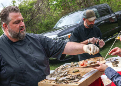Chef Erik passing oysters at Hillbrook Inn's 2022 Root to Table event