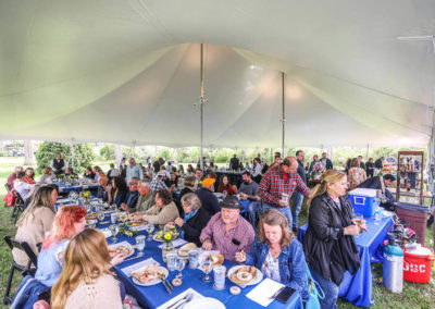 View of guests under the tent at Hillbrook Inn's 2022 Root to Table event