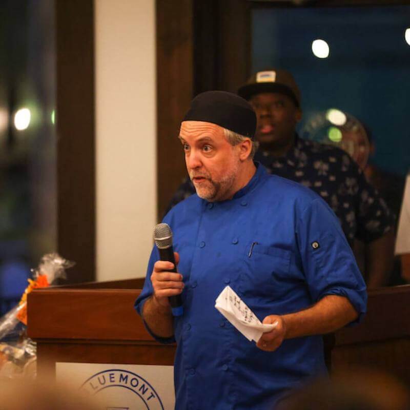 Chef Reid Badger of Between the Hills Catering Speaking to Guests