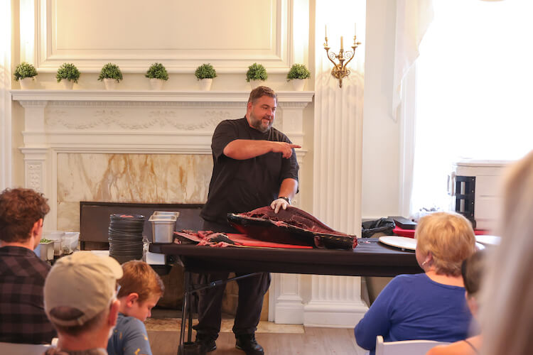 Chef Erik demonstrating cutting a 300 lbs Tuna